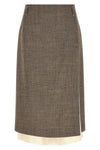 the midi skirt tela redefines the codes of contemporary tailoring through a play