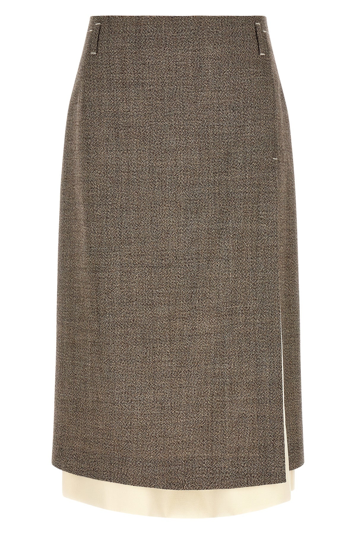 the midi skirt tela redefines the codes of contemporary tailoring through a play