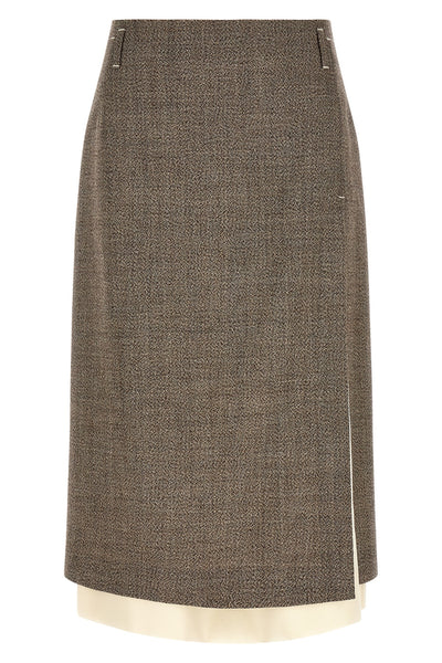 the midi skirt tela redefines the codes of contemporary tailoring through a play