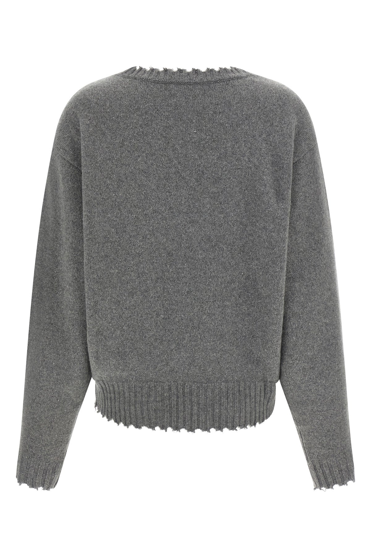 the nude v-neck sweater redefines knitwear codes through a deconstructed aesthet