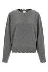 the nude v-neck sweater redefines knitwear codes through a deconstructed aesthet