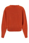 the v-neck sweater nude stands out for its pure cashmere construction that combi