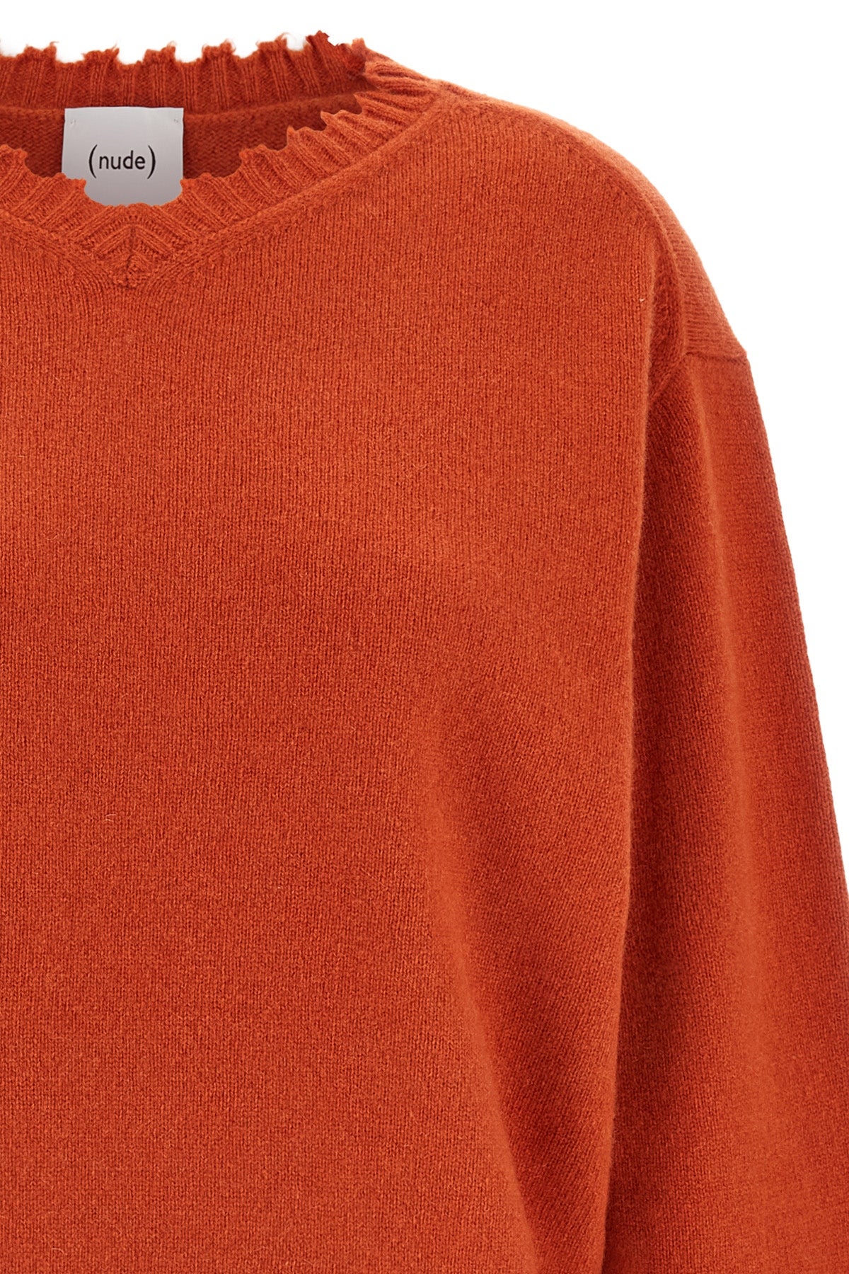 the v-neck sweater nude stands out for its pure cashmere construction that combi