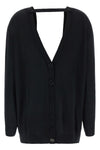 the pure wool cardigan nude redefines the codes of knitwear through a fluid and