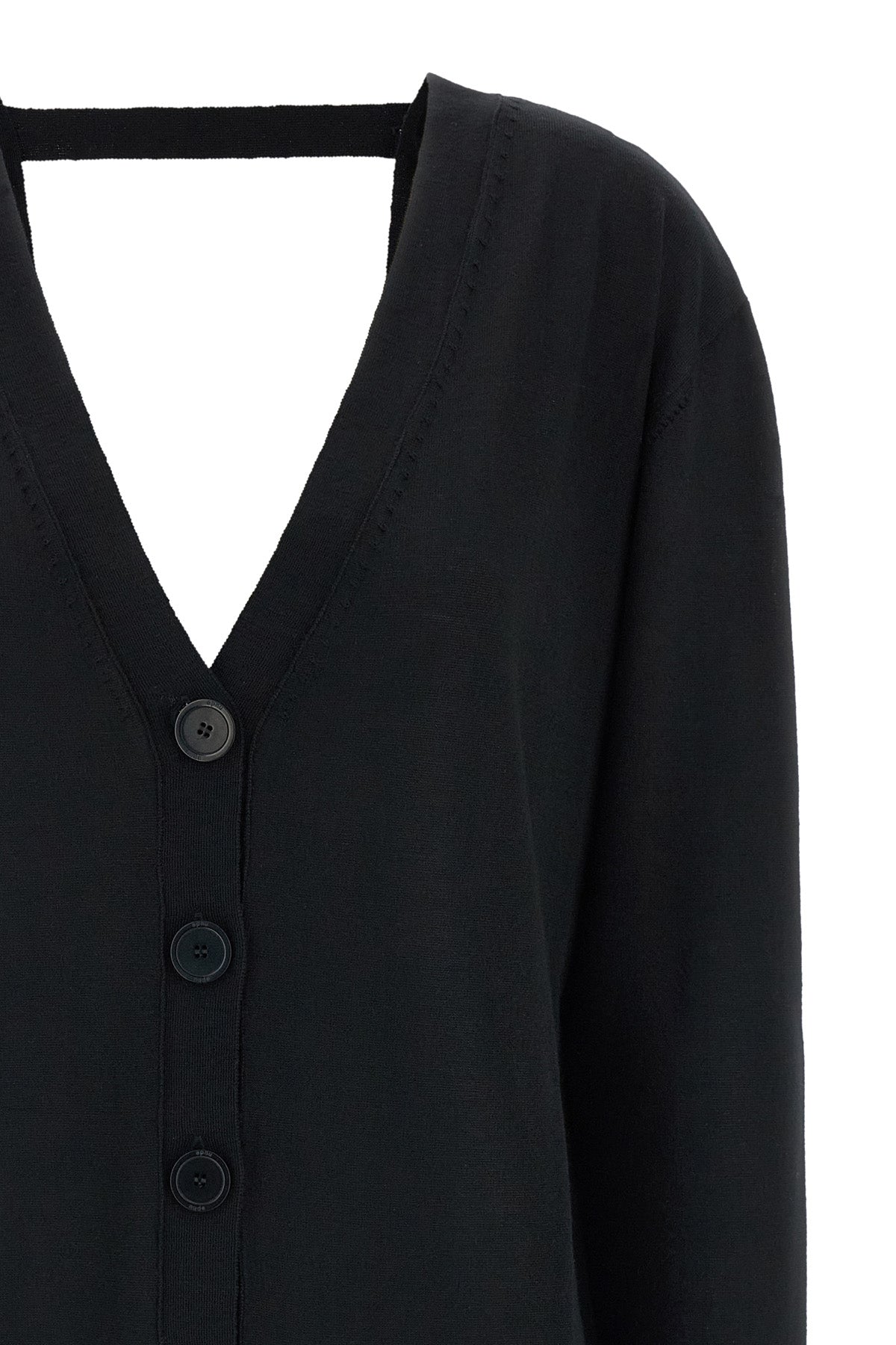 the pure wool cardigan nude redefines the codes of knitwear through a fluid and