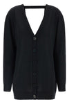 the pure wool cardigan nude redefines the codes of knitwear through a fluid and