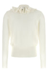 the nude cardigan is distinguished by a fine knit construction