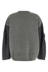 the nude crew neck sweater redefines contemporary knitwear through an oversized