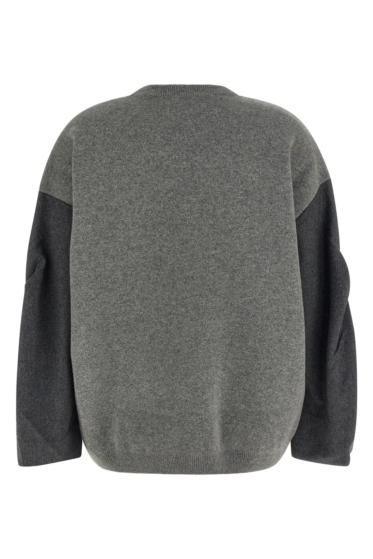 the nude crew neck sweater redefines contemporary knitwear through an oversized