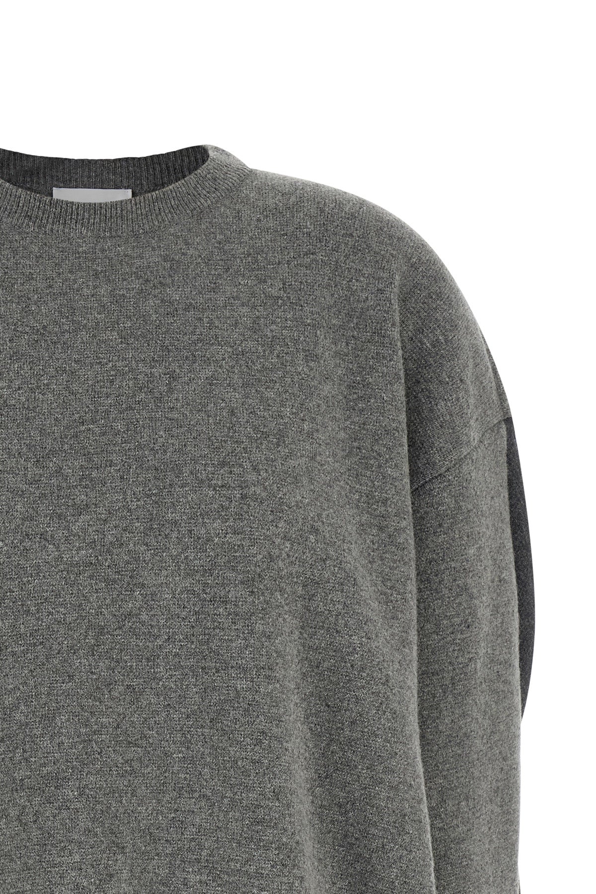 the nude crew neck sweater redefines contemporary knitwear through an oversized