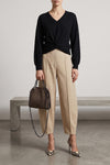 the nude v-neck sweater redefines the volumes of classic knitwear through a scul