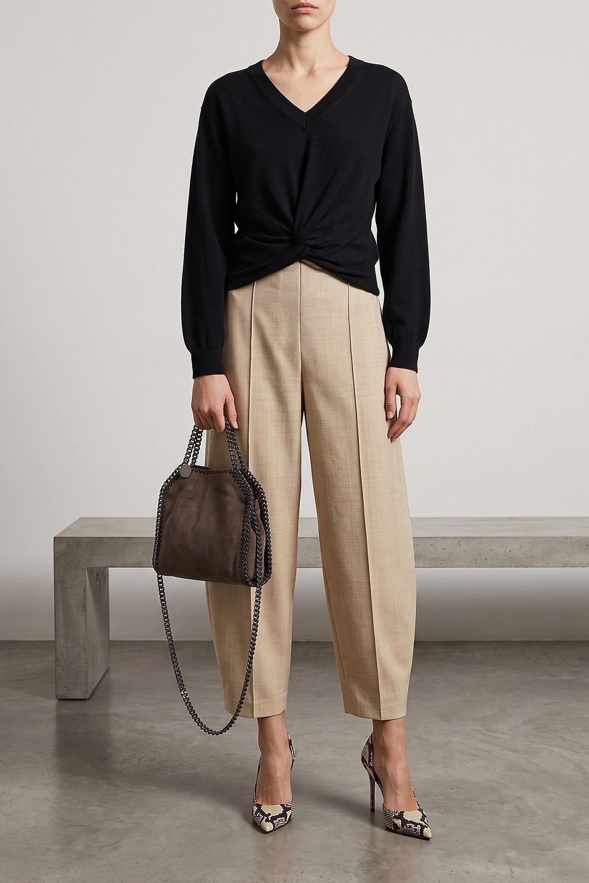 the nude v-neck sweater redefines the volumes of classic knitwear through a scul