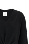 the nude v-neck sweater redefines the volumes of classic knitwear through a scul