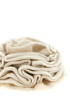 the floral accessory (nude) is distinguished by a sculptural construction in sof