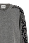the nude knit redefines the elegance of knitwear through a bold material contras