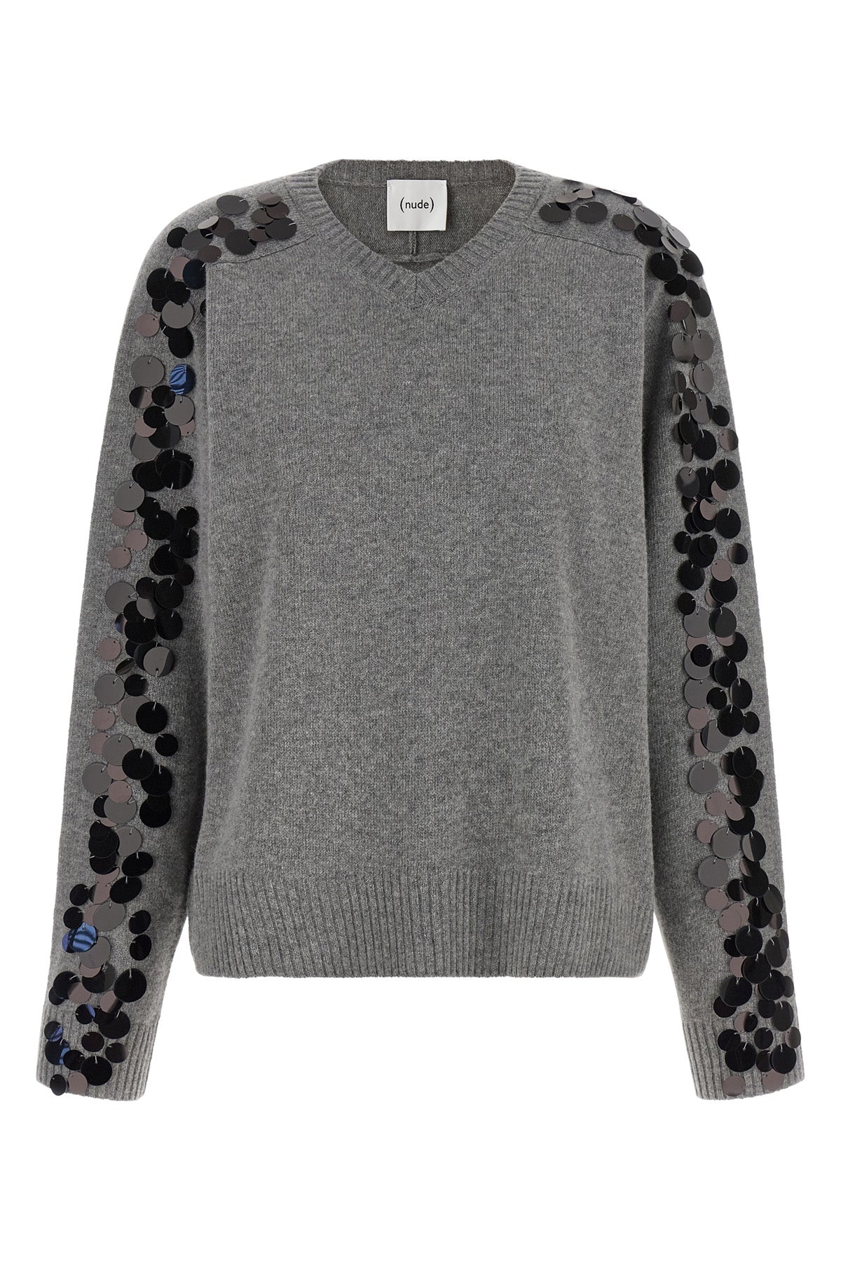 the nude knit redefines the elegance of knitwear through a bold material contras