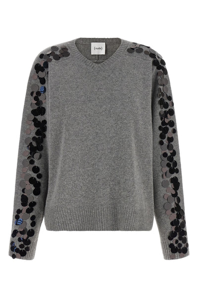 the nude knit redefines the elegance of knitwear through a bold material contras