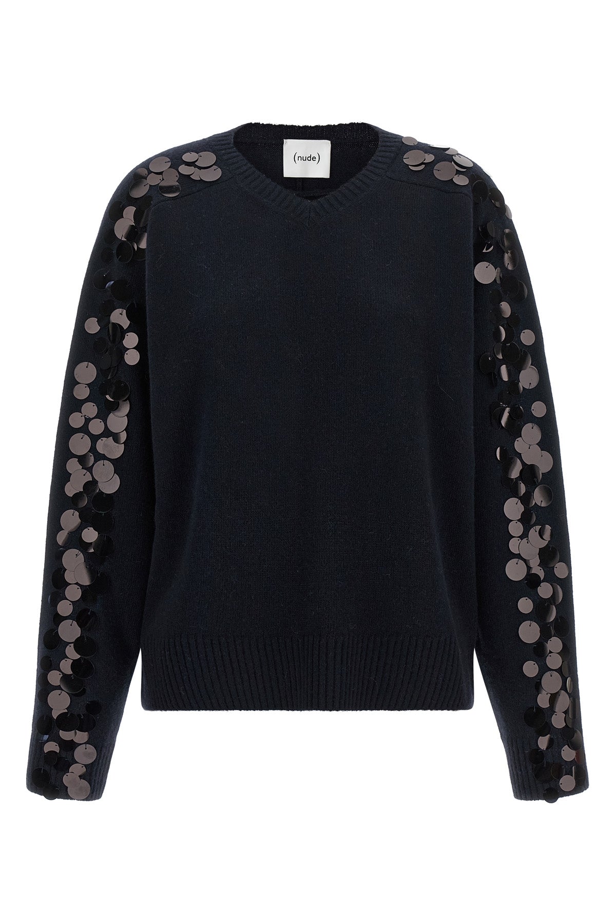 the nude knit redefines contemporary knitwear through a bold material contrast