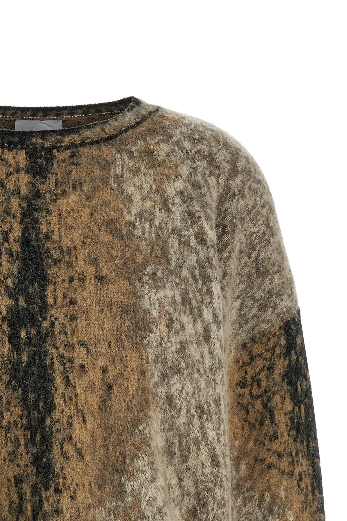 the nude crew neck sweater is distinguished by an oversized silhouette