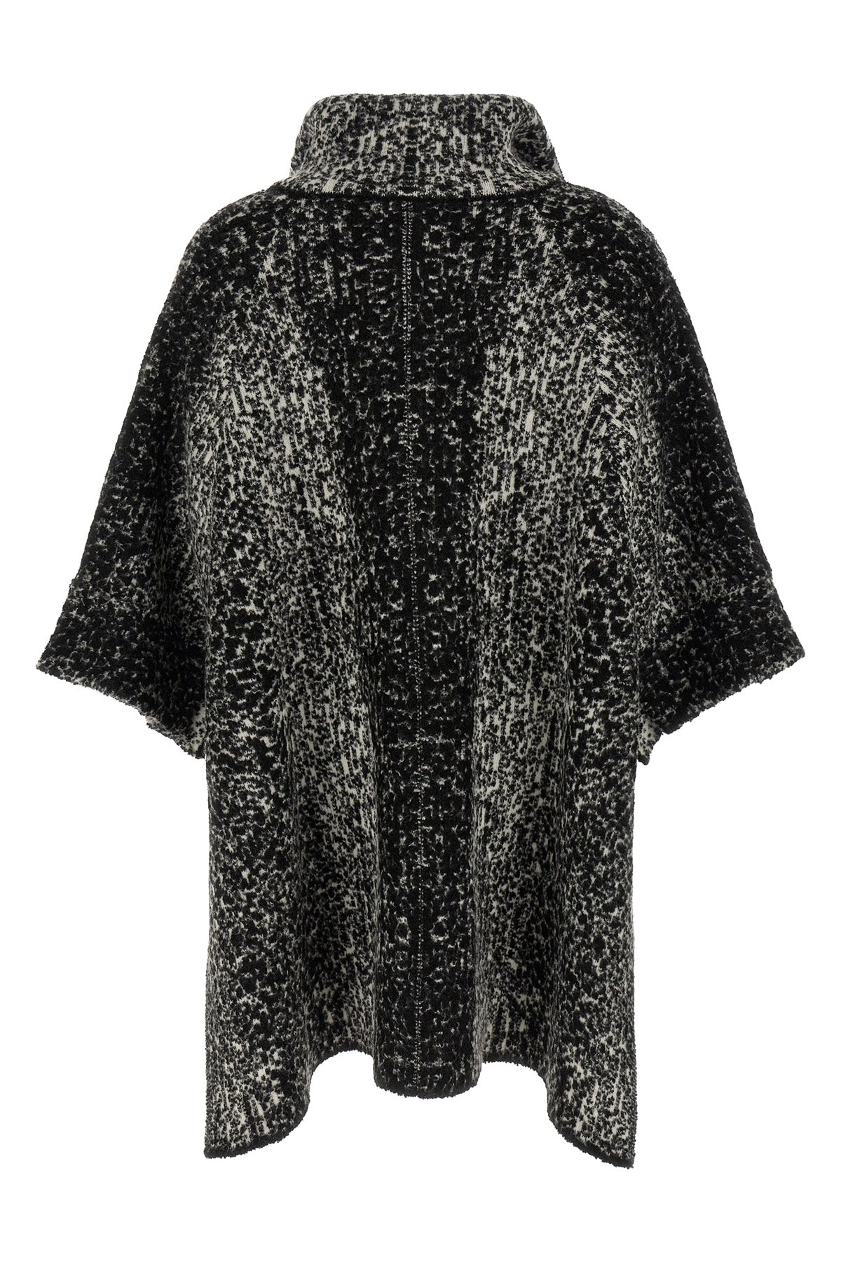 the nude knit coat redefines the volumes of contemporary outerwear through a cap