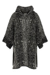 the nude knit coat redefines the volumes of contemporary outerwear through a cap