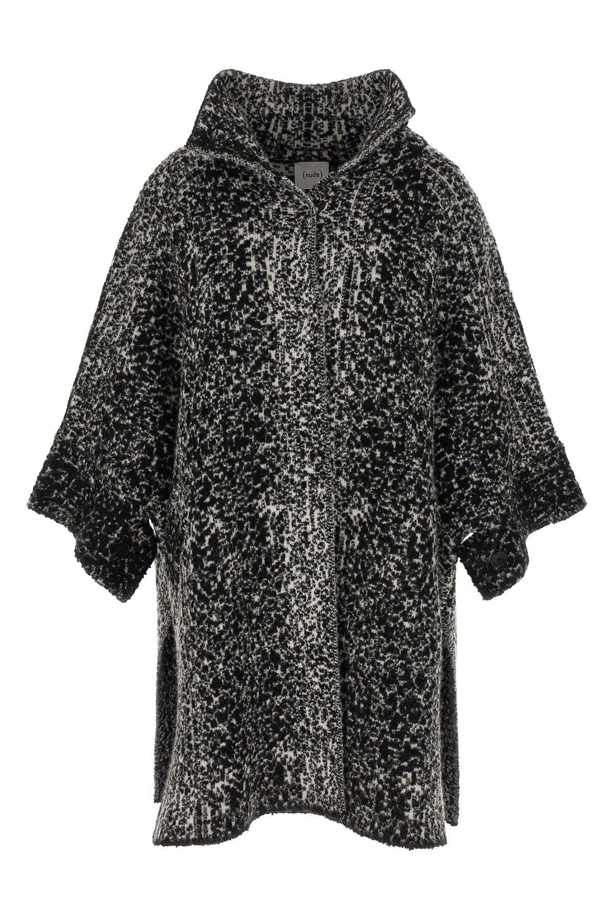 the nude knit coat redefines the volumes of contemporary outerwear through a cap