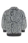 the nude cardigan is distinguished by a knit construction
