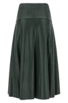 the nude midi skirt redefines the codes of contemporary elegance through a flare