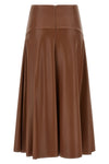 the midi skirt nude redefines the volumes of the contemporary wardrobe through a