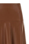 the midi skirt nude redefines the volumes of the contemporary wardrobe through a