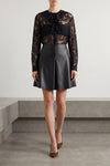 the nude mini skirt defines a flared silhouette