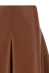 the nude mini skirt defines a flared silhouette