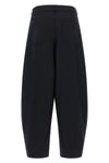 the nude trousers redefine the volumes of the daily wardrobe through a barrel-sh
