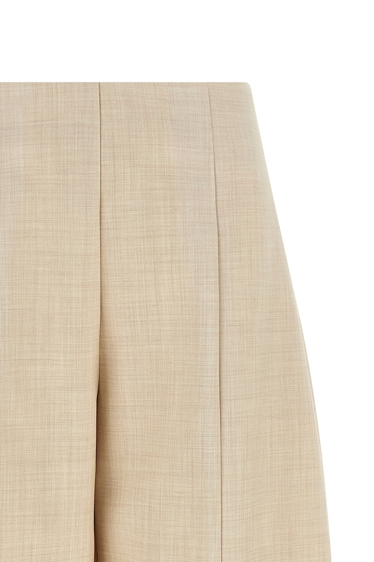 nude trousers redefine sartorial volumes through a distinctive balloon silhouett