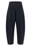 the nude pants define new volumes through a rigorous sartorial construction