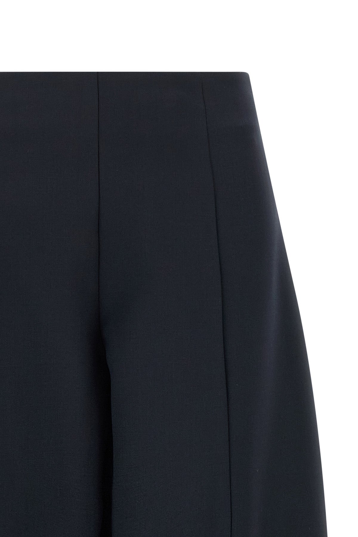 the nude pants define new volumes through a rigorous sartorial construction
