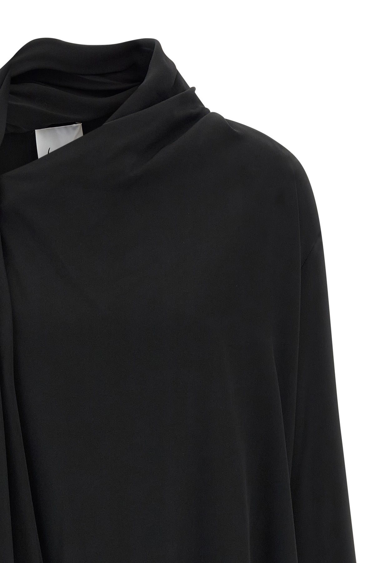 the nude blouse is distinguished by a sartorial construction focused on volume a