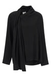 the nude blouse is distinguished by a sartorial construction focused on volume a