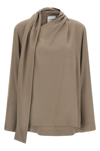 the nude blouse is distinguished by a fluid silhouette and an asymmetrical desig