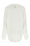 the nude blouse is distinguished by a fluid and deconstructed silhouette