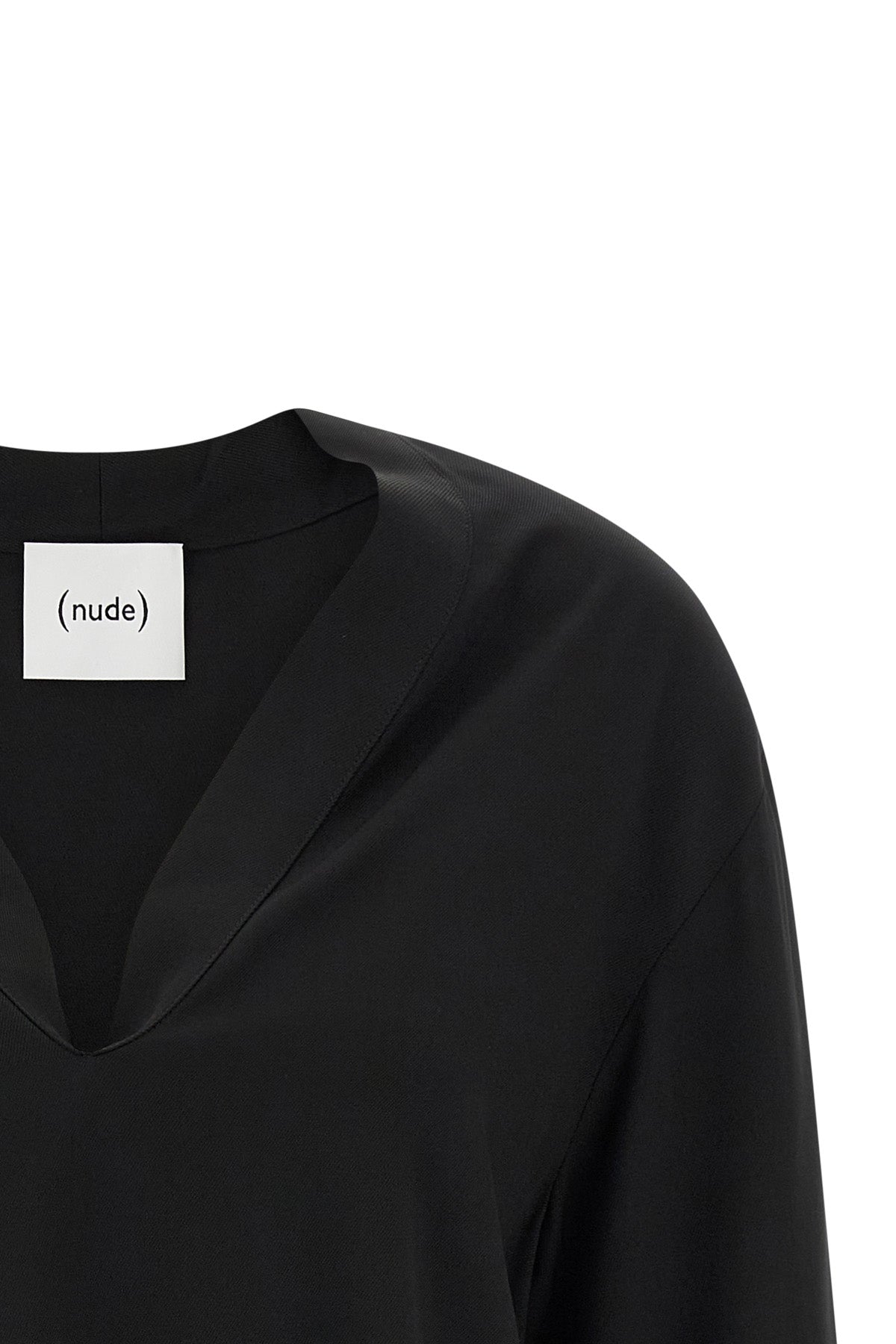 (nudes) long-sleeved blouse redefines minimalist elegance through a fluid silho