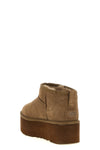 the ugg ankle boots redefine the brands iconic silhouette through bold proporti