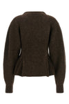 the rotate birger christensen peplum cardigan defines a sculptural silhouette th