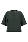the emily tela crop blouse redefines the proportions of everyday wardrobe thro