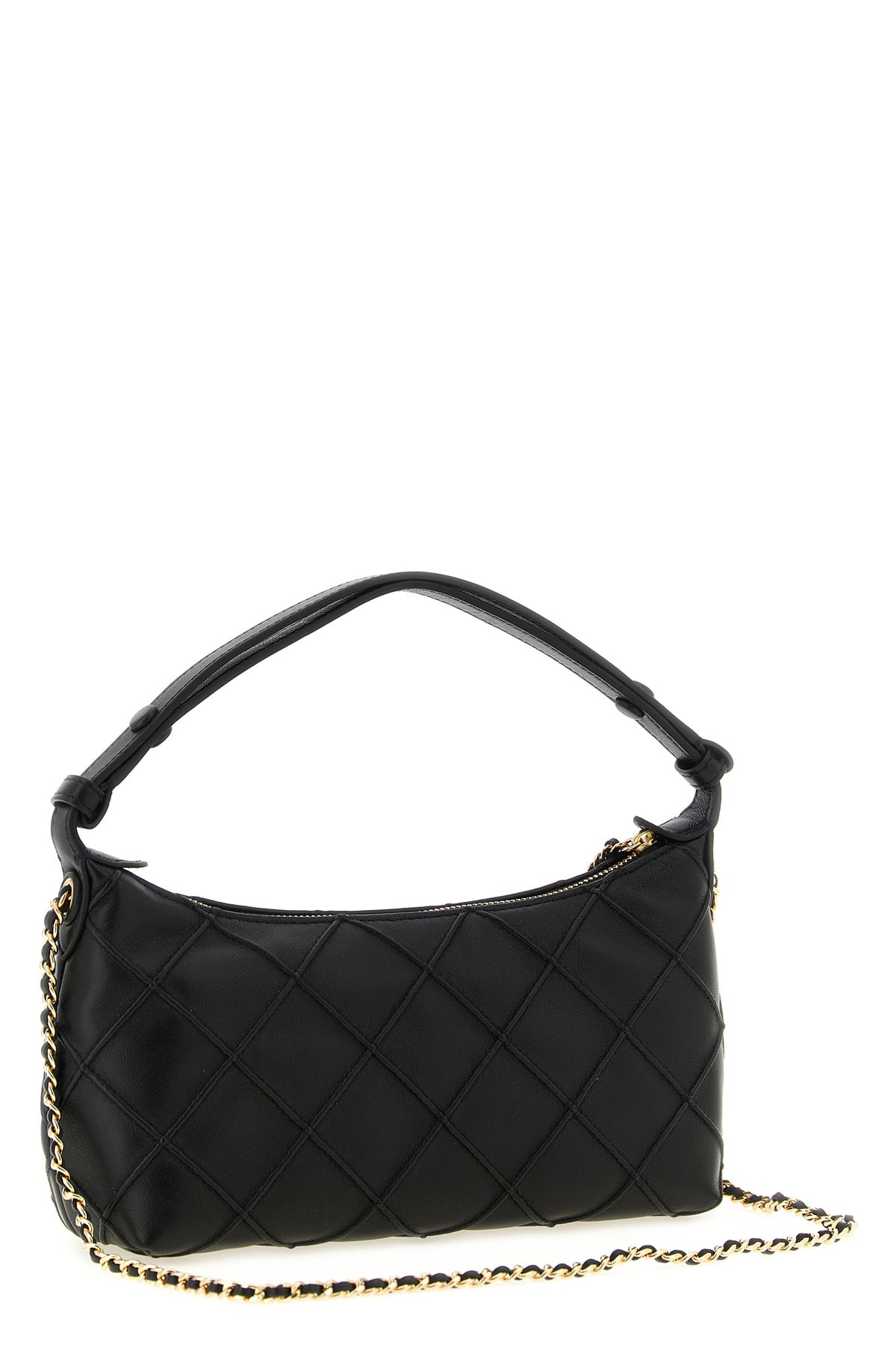the tory burch fleming clutch redefines the codes of everyday elegance through