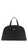 the romy tory burch trunk bag stands out for its structured and rounded silhouet