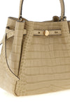 the tory burch romy small bucket bag stands out for its structured silhouette