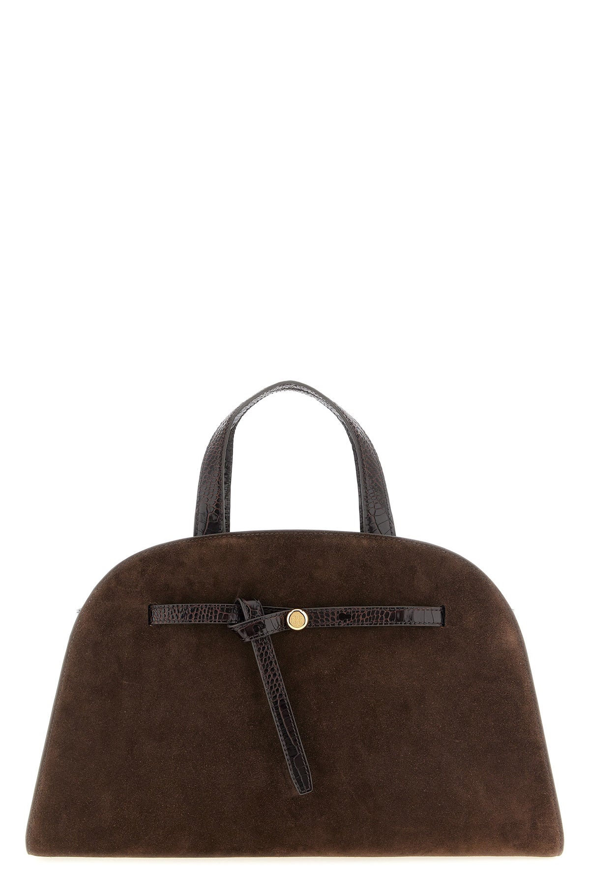 the tory burch romy trunk bag embodies a material elegance through the contrast