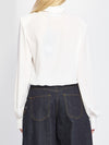 blusa incrociata con sciarpina