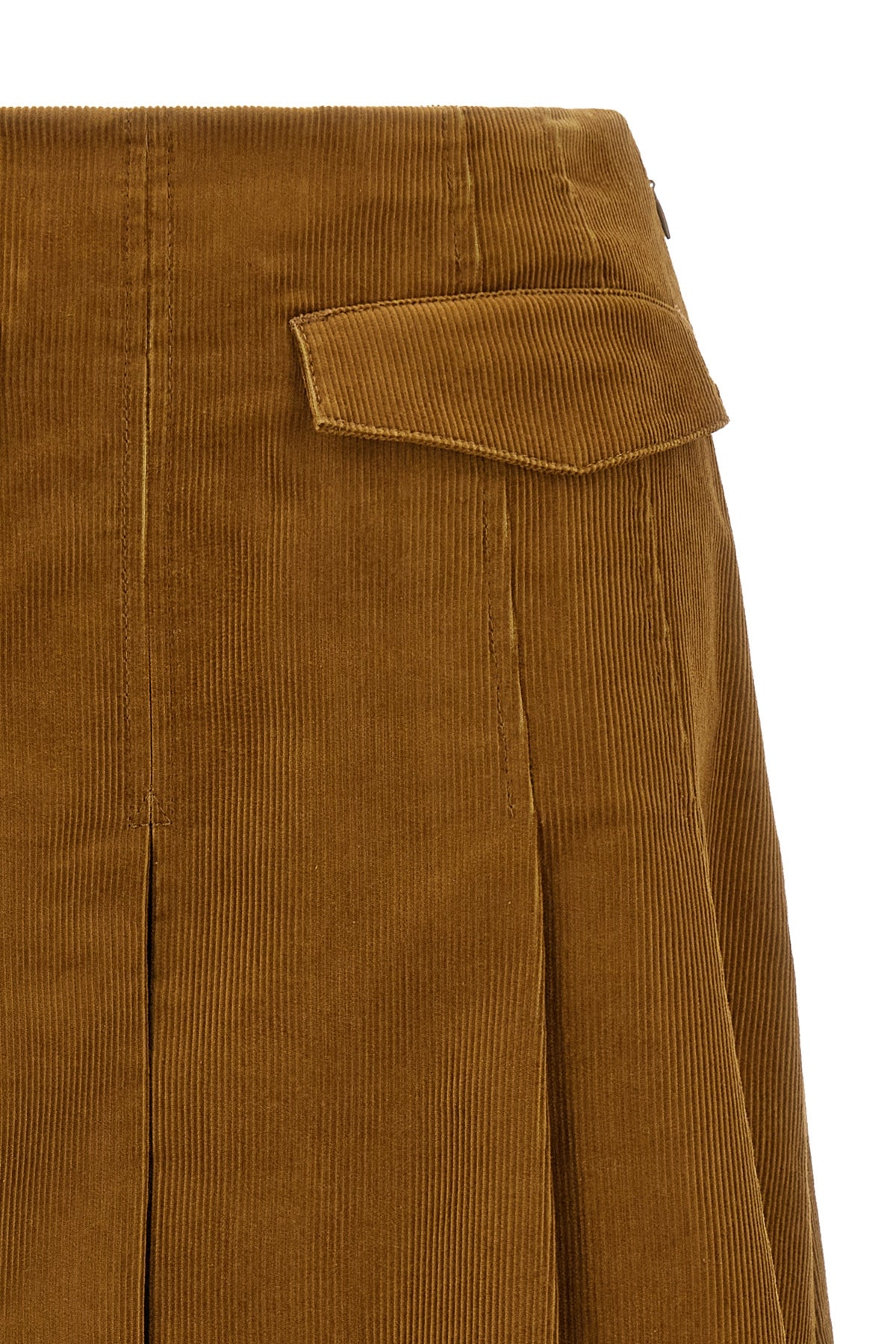 the pleated tory burch midi skirt defines a new concept of volume through a rigo